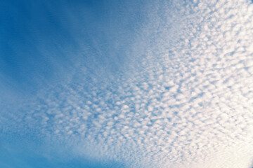 Fluffy white clouds flying on blue sky background