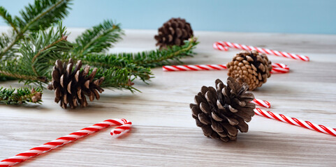 Christmas tree branches and pine cones on the table. Christmas, fir tree, Christmas preparation,...