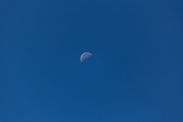 Bright moon in the blue sky of the Caucasus.