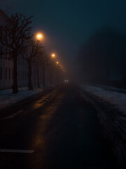 Fogy street and a car in the distance 