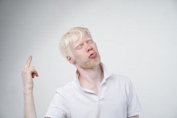 portrait of an albino man in studio dressed t-shirt isolated on a white background. abnormal...