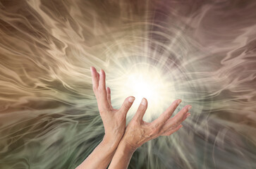 High Resonance Healing Energy Concept Background - female hands sensing vibrant radiating healing energy and swirling energy field background with copy space
