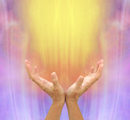 Abundant Golden Healing Energy Flows with Intention - female hands reaching up towards a shaft of golden energy  against a pink purple background

