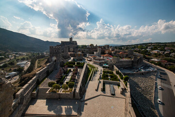ancient fortress with towers and gardens