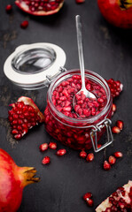 Some healthy preserved Pomegranate seeds (selective focus; close-up shot)