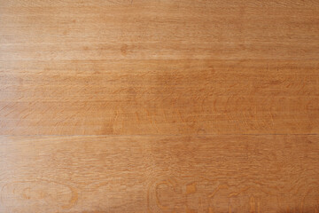 Wooden board of a rustic table view in close up from top