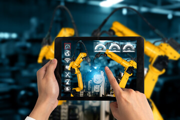 Engineer controls robotic arms by augmented reality industry technology application software. Smart...