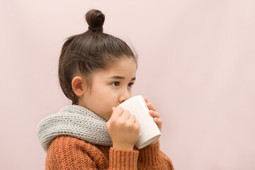 a girl drinking warm drink