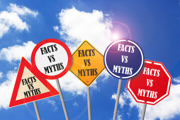 facts vs myths on road sign with a blue sky and white cloud 