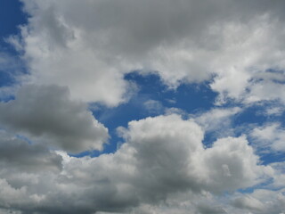 Obraz premium Cumulus cloud on beautiful blue sky in day light , Fluffy clouds formations at tropical zone 