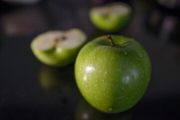 green apples on a black background