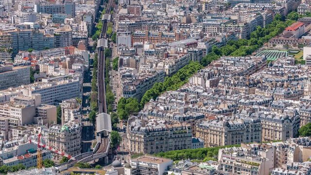 Top view of Paris skyline from above timelapse. Main landmarks of european megapolis with Boulevard de Grenelle and metro line. Bird-eye view from observation deck of Montparnasse tower. Paris, France