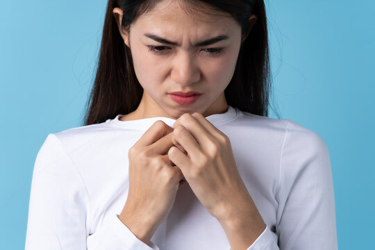 Woman Smelling Bad From Her Shirt Because Dirty Laundry.