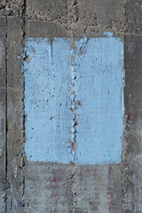 Concrete texture with blue  painted  rectangle in the center 