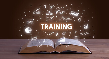 TRAINING inscription coming out from an open book, business concept