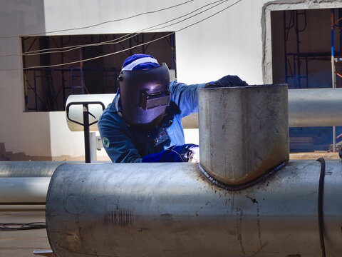 Welder at work in a construction site.
