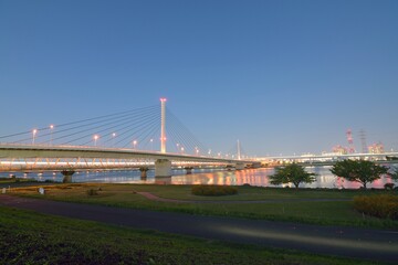 Fototapeta na wymiar Long exposure urban landscape of suspension bridge in dusk sky background