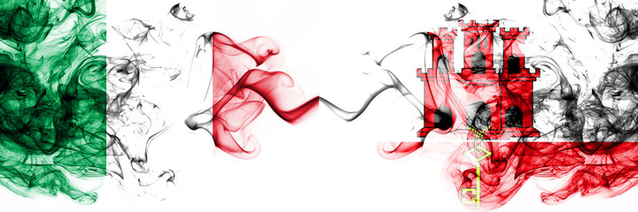 Fototapeta na wymiar Italy vs Gibraltar smoky mystic flags placed side by side. Thick colored silky abstract smoke flags