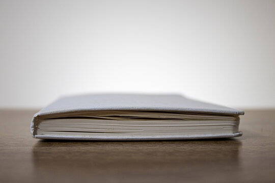 Side profile of a notebook. Aged notebook pages.