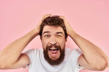 Bearded man white t-shirt cropped view lifestyle studio pink background