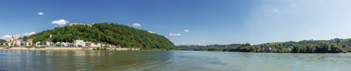 Fototapeta premium The confluence of the Danube, the Inn and the Ilz seen from the eastern tip of the historic city of Passau