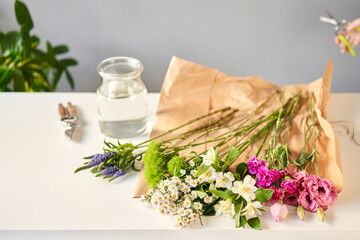 Obraz na płótnie Canvas Bouquet 007, step by step installation of flowers in a vase. Flowers bunch, set for home. Fresh cut flowers for decoration home. European floral shop. Delivery fresh cut flower.