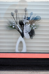 Colourful Display in Window with White Background  Blinds 
