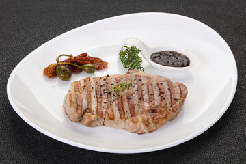 Grilled pork steak with pepper sauce