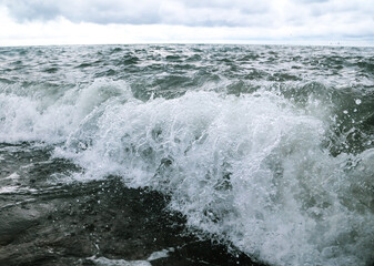Wave in the sea with splashing water.