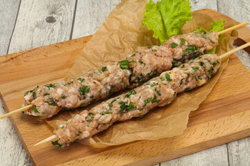 Raw minced pork skewer kebab for grill