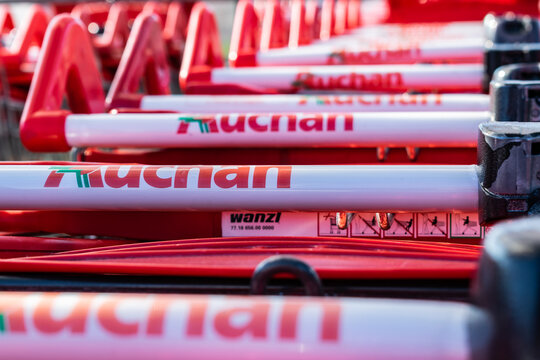 Roncq,FRANCE-February 25,2018: Close-up shopping trolleys Auchan hypermarket.Auchan is a French international supermarket chain, is one of the largest distribution groups in the world.