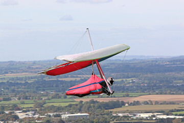 Fototapeta na wymiar Hang Glider flying at Westbury, Wiltshire 