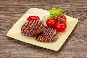 Grilled burger cutlet with sauce