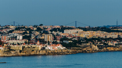 View from Cascais eastwards towards Lisbon with Ponte 25 de Abril and Rei Cristo visible, Lisbon, Portugal