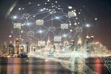 Double exposure of envelop hologram flying from gadget and city view background. Concept e-mail.