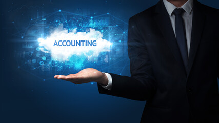 Hand of Businessman holding ACCOUNTING inscription, successful business concept