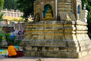 India Bodh Gaya - Mahabodhi Temple Complex monk reading sutra records