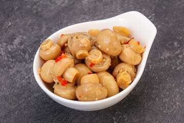 Pickled champignons in the bowl