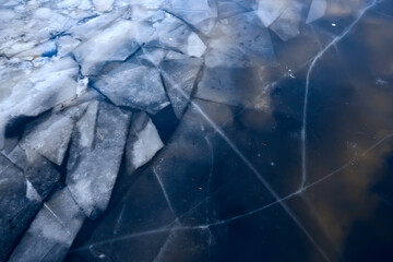 blue ice glass background, abstract texture of the surface of the ice on the glass, frozen seasonal water