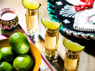 Three shots of tequila in tall shot glasses