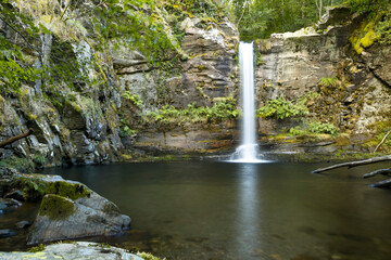 Fototapeta na wymiar beautiful waterfall falling over a pool of crystal clear water in O Courel.