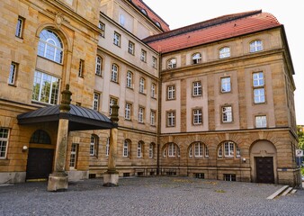 Obraz premium Art square of Chemnitz. Germany. 10.11.2011. Opera building near St. Peter's Church and details of historical building.