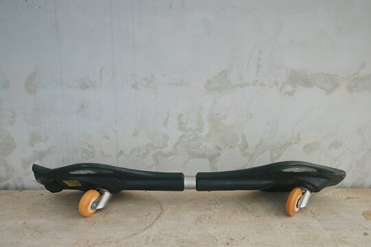 Old Snakeboard on the floor.