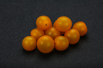 Fresh yellow cherry tomato heap