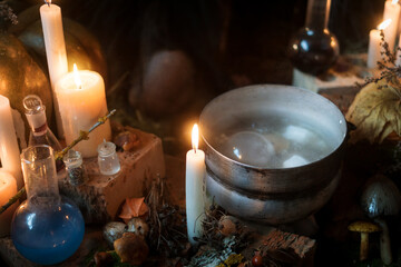 candles, pumpkins, and a pot of witch potion on the fire. Halloween