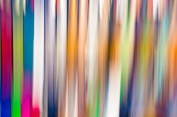 Blurred abstract background of multicolored stripes. Motion blur. Photography blur.
