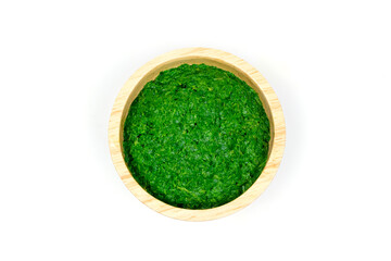 Neem leaf used as ayurvedic medicine on wooden bowl isolated on white background. Neem leaf is an excellent moisturizing and contains various compounds that have insecticidal and medicinal properties.