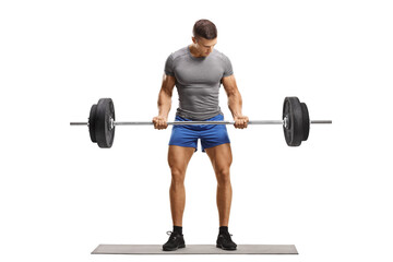 Full length portrait of a muscular young man in sportswear lifting weights