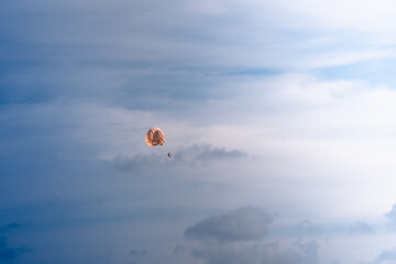 Parasailing in blue sky. Sports, active leisure, travel, vacation concept