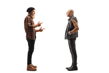 Obraz premium Full length profile shot of a bearded guy standing and talking to a punk in leather clothes